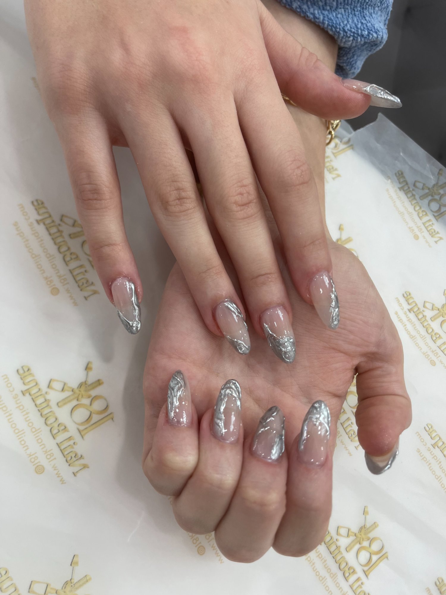 Silver chrome marble nail design